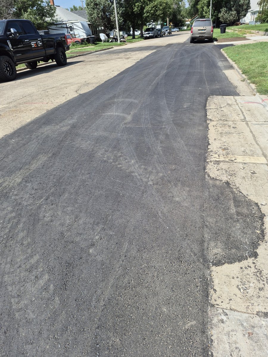 Asphalt overlay on a residential street in Williston, ND